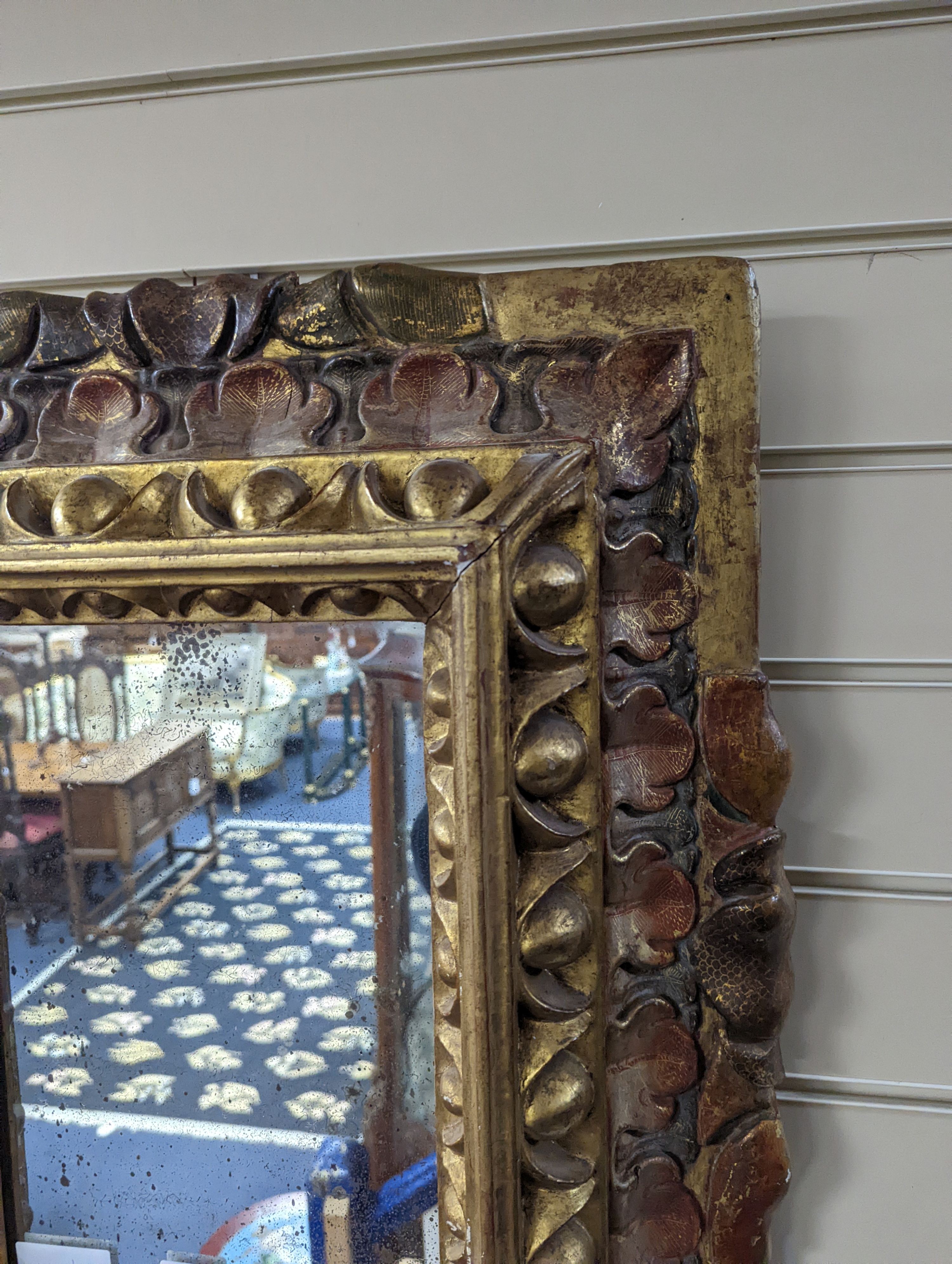 An 18th century painted Italian carved giltwood rectangular wall mirror, width 50cm, height 63cm